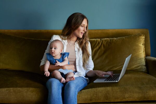 imgi 104 mother sitting with new born baby and laptop royalty free image 1577769106